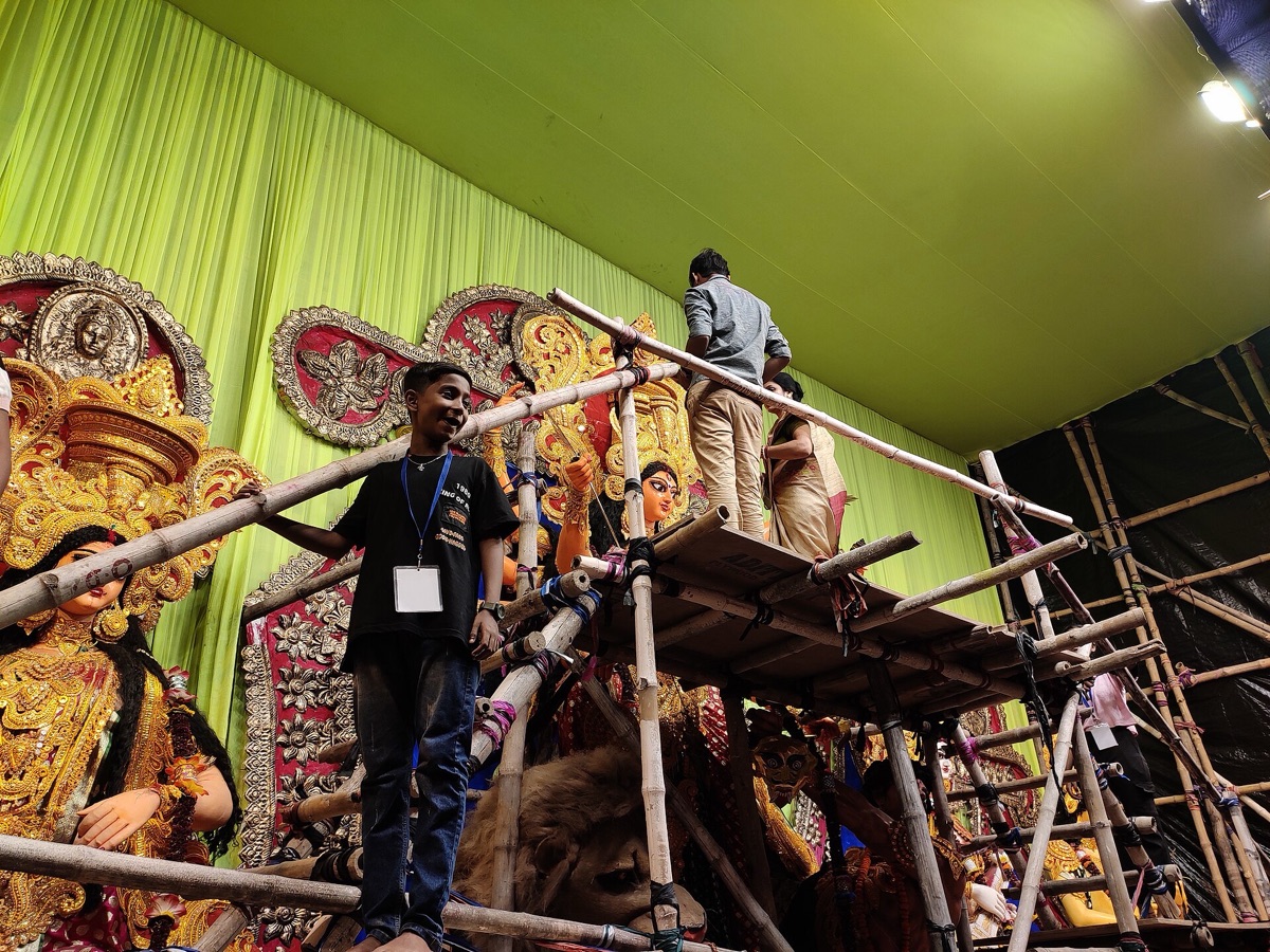 Women with vermilion on their faces during sindur khela at a Durga Puja pandal in Kolkata